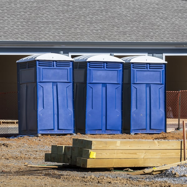 what is the cost difference between standard and deluxe portable restroom rentals in Marshall